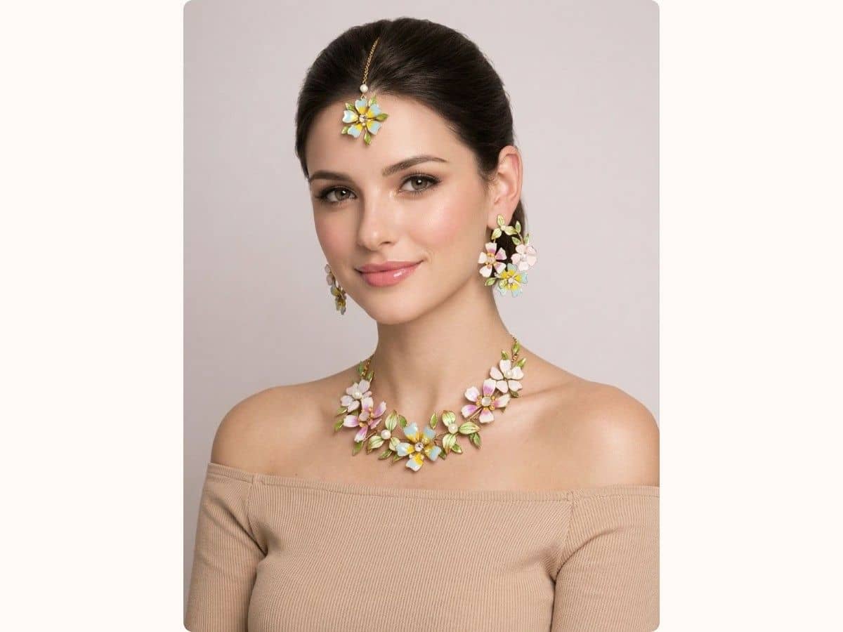 Pastel resin-flower necklace with pink, yellow and blue petals, matching earrings and a maang tikka