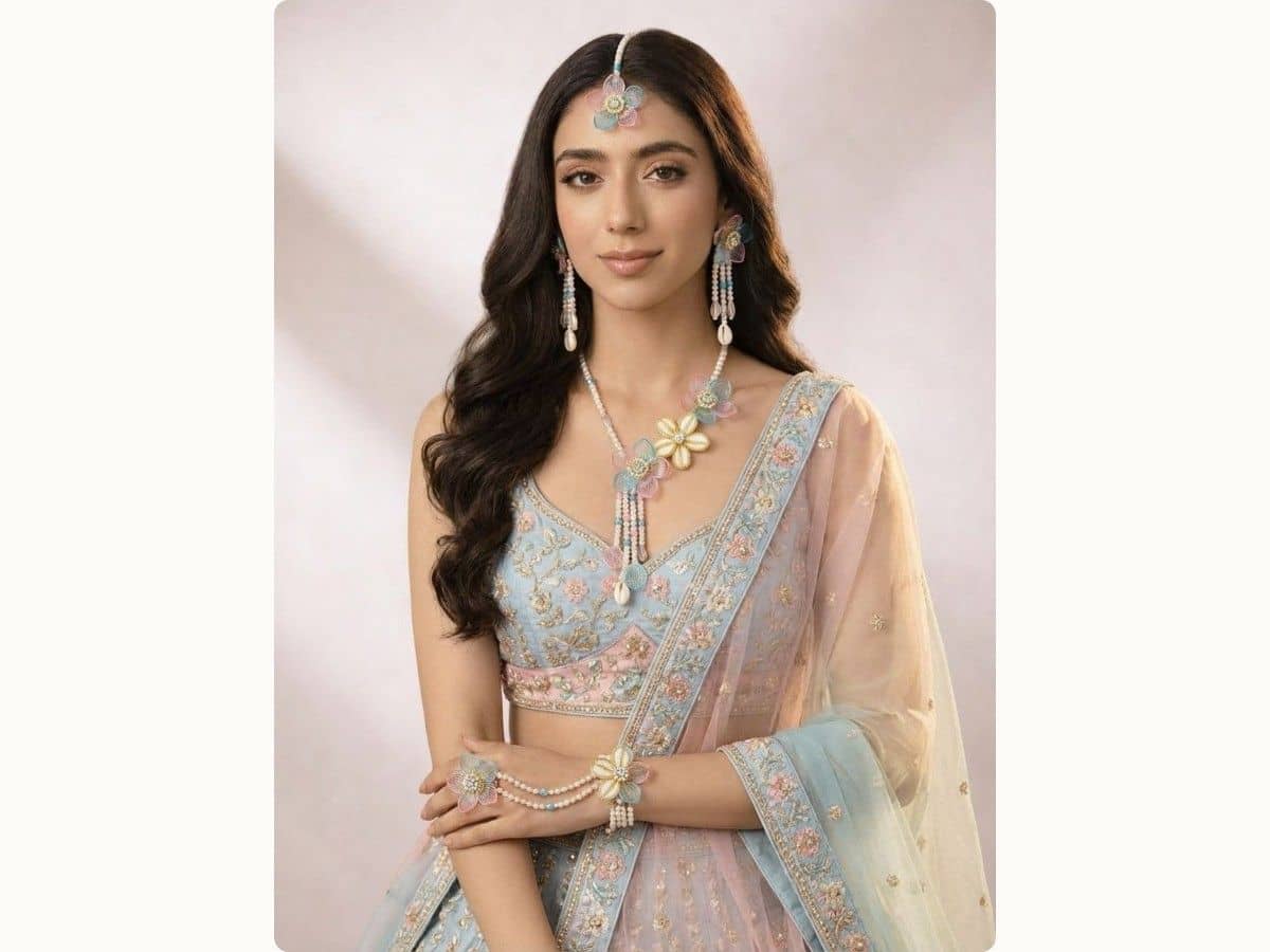Sky blue and light pink acrylic flower set with maang tikka, long drop earrings, long necklace and haathphool, worn with a pale blue and pink lehenga